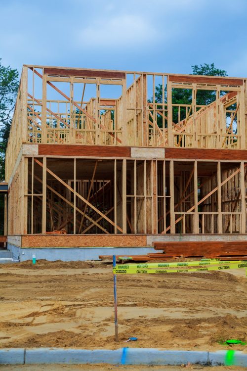 House under construction upward view through residential, wood construction framing for a house