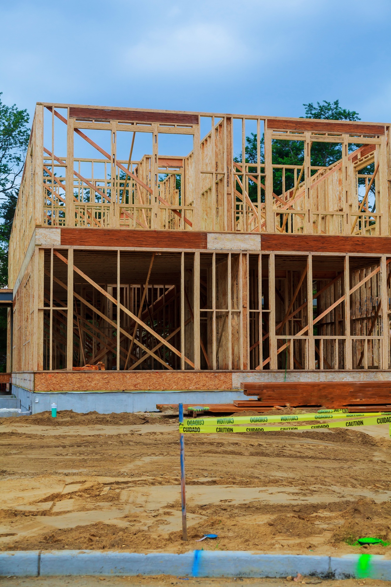 House under construction upward view through residential, wood construction framing for a house